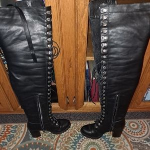 Milwaukee thigh high lace up motorcycle boots.